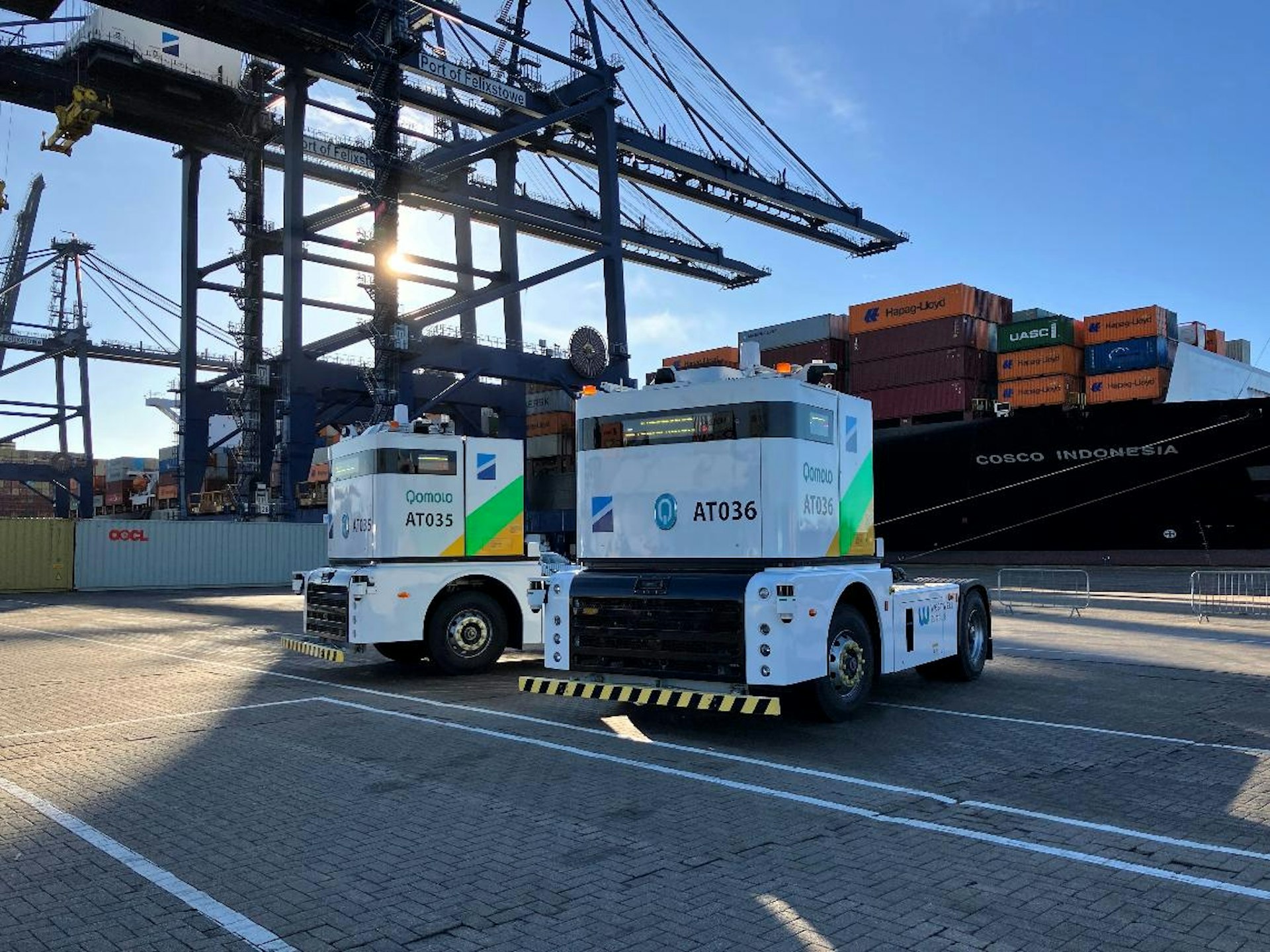 Two small lorries in shipping port